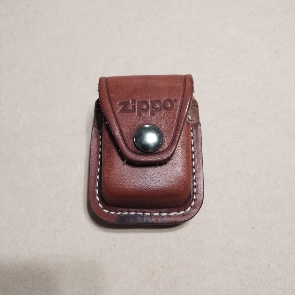 Zippo lighter leather pouch holder that clips to pants. Tan leather color